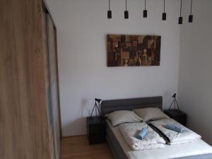 A bed or beds in a room at The Old Mill Budapest