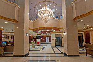 a lobby of a hotel with a chandelier at Diyar Al Nakheel Hotel in Al Madinah