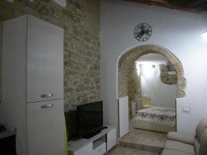 TV a/nebo společenská místnost v ubytování Le Vecchie Mura Apartment