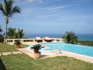 a swimming pool with a view of the ocean at Bella Vista in Las Terrenas