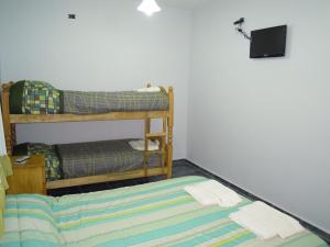Postel nebo postele na pokoji v ubytování Cabañas y Hotel Ebemys