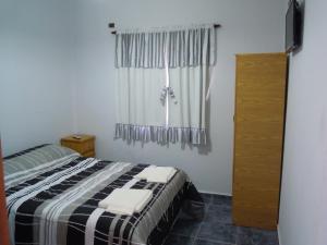 Postel nebo postele na pokoji v ubytování Cabañas y Hotel Ebemys