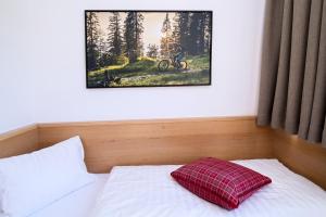 Postel nebo postele na pokoji v ubytování Alpenrose Nassfeld