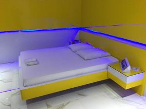 Postel nebo postele na pokoji v ubytování MOTEL LIBIDUS - Foz do Iguaçu