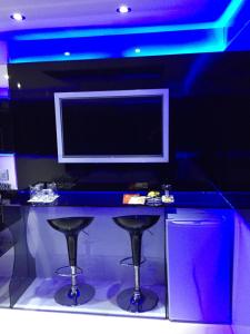 TV a/nebo společenská místnost v ubytování MOTEL LIBIDUS - Foz do Iguaçu + 12 fotografií
