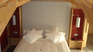 Postel nebo postele na pokoji v ubytování Hotel Garni Vittoria
