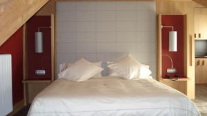 Postel nebo postele na pokoji v ubytování Hotel Garni Vittoria
