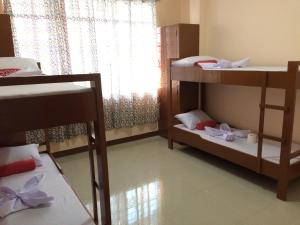Postel nebo postele na pokoji v ubytování Brielles Travellers Inn