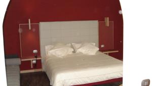 Postel nebo postele na pokoji v ubytování Hotel Garni Vittoria