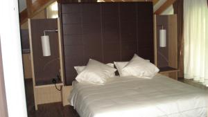 Postel nebo postele na pokoji v ubytování Hotel Garni Vittoria