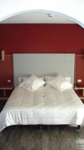 Postel nebo postele na pokoji v ubytování Hotel Garni Vittoria