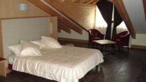 Postel nebo postele na pokoji v ubytování Hotel Garni Vittoria