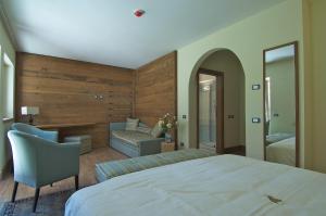 Postel nebo postele na pokoji v ubytování Hotel Garni Vittoria