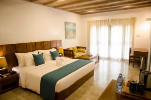 Postel nebo postele na pokoji v ubytování Regenta Arie Lagoon Negombo