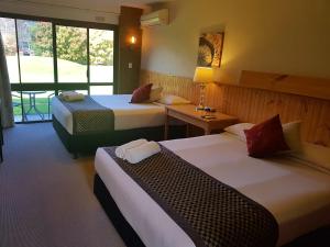 Postel nebo postele na pokoji v ubytování Motel Sierra - Bright