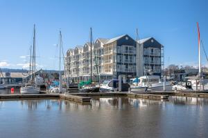 a marina with boats docked in front of a building at Peppers Seaport Hotel in Launceston