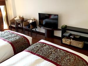 Postel nebo postele na pokoji v ubytování Hotel Green Plaza Hakone