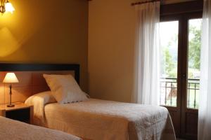 Ένα ή περισσότερα κρεβάτια σε δωμάτιο στο Posada Campa