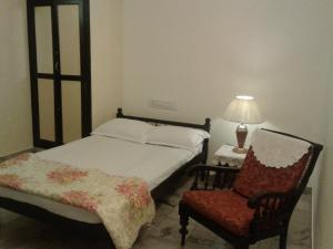 Postel nebo postele na pokoji v ubytování Padamadan homestay