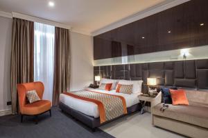 Ένα ή περισσότερα κρεβάτια σε δωμάτιο στο Hotel Gioberti