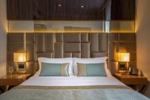 Ένα ή περισσότερα κρεβάτια σε δωμάτιο στο Hotel Gioberti