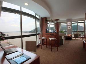 an office with a large room with a view of the ocean at River Hotel in Hà Tiên