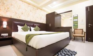 Letto o letti in una camera di Treebo King'S Court Chandrasekharpur