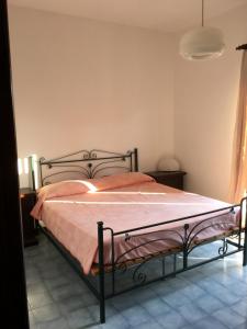 Tempat tidur dalam kamar di Villetta Scossicci