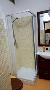 a bathroom with a shower and a sink at La casa del corso in Aragona +55 photos