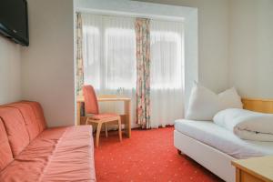 Postel nebo postele na pokoji v ubytování Alpenhotel Regina