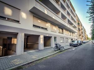 a bike parked on a street next to a building at Aux bons amis - Parlement/Orangerie in Strasbourg
