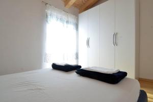 Łóżko lub łóżka w pokoju w obiekcie Villa Blue 2