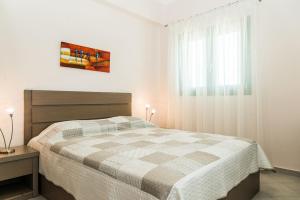 Säng eller sängar i ett rum på Villa Kampos