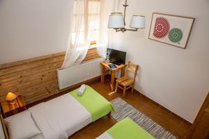 A bed or beds in a room at Kurpiowska Kraina