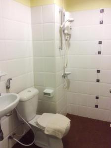 a bathroom with a toilet and a sink at T.P. Place Hotel in Phangnga +30 photos