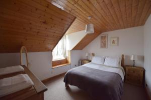 A bed or beds in a room at The Old School House