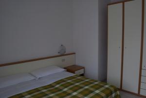 Postel nebo postele na pokoji v ubytování Residence Hotel Baia del Sole