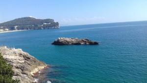 an island in the middle of a large body of water at L'Ancorotto Azzurro in Gaeta +14 photos