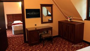 Postel nebo postele na pokoji v ubytování Artemis Resort Wellness Hotel