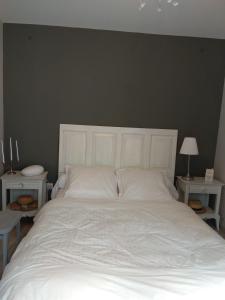 En eller flere senge i et værelse på Maison MARYSA