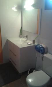 a bathroom with a white sink and a toilet at Holiday Home Villa Kay Malouz in Saint-Joseph +17 photos