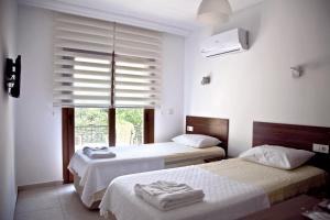Postel nebo postele na pokoji v ubytování Şahin Motel & Restaurant