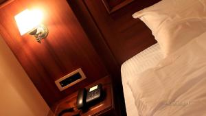 Postel nebo postele na pokoji v ubytování Artemis Resort Wellness Hotel