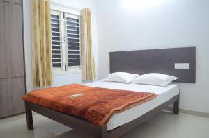 صورة لـ Blackroots Serviced Apartments في كويمباتور