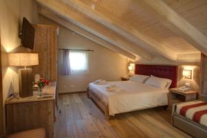 Säng eller sängar i ett rum på Agriturismo Costa di Faraggiana