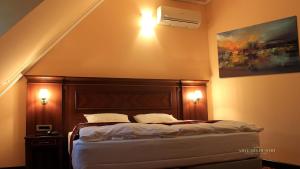 Postel nebo postele na pokoji v ubytování Artemis Resort Wellness Hotel