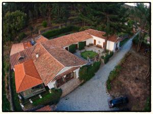 an aerial view of a house with orange roofs at Palacio Manco Capac by Ananay Hotels in Cusco