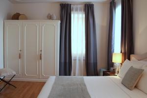 Кровать или кровати в номере Primaluce