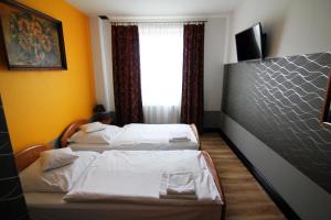 Postel nebo postele na pokoji v ubytování FusGym Resort