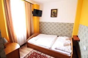 Postel nebo postele na pokoji v ubytování FusGym Resort